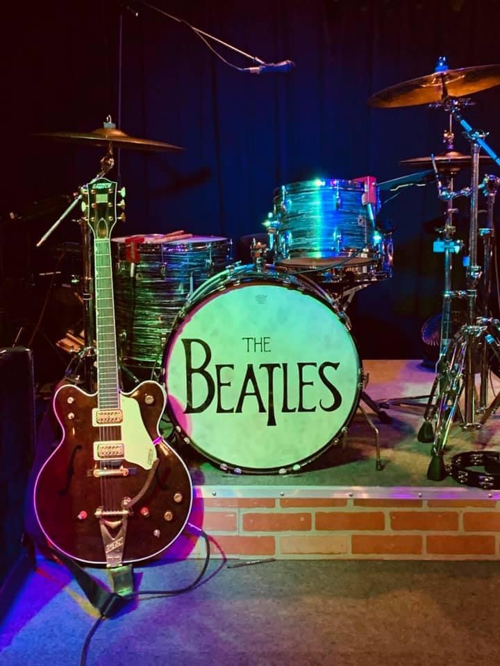 Boots & Suits guitarist with a Gretsch guitar beside the drum kit