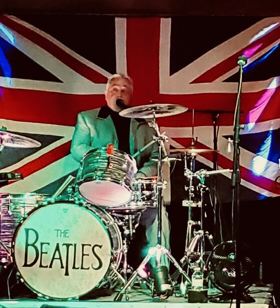 Boots & Suits performing live with a Union Jack stage backdrop